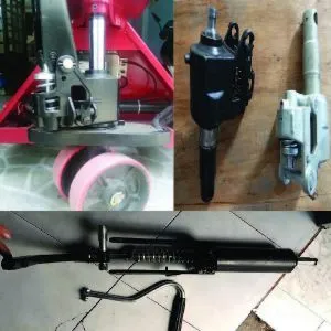 Bơm thủy lực xe nâng tay đang được tháo rời để sửa chữa