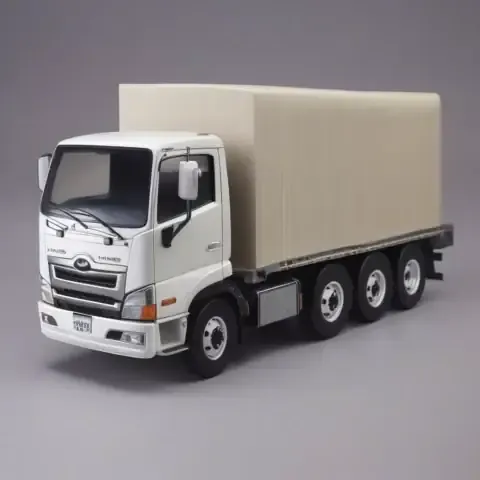 Chiếc mô hình ô tô bằng giấy đang trong giai đoạn hoàn thiện, với phần mái và thân xe đã được định hình, sẵn sàng cho công đoạn lắp đặt chi tiết