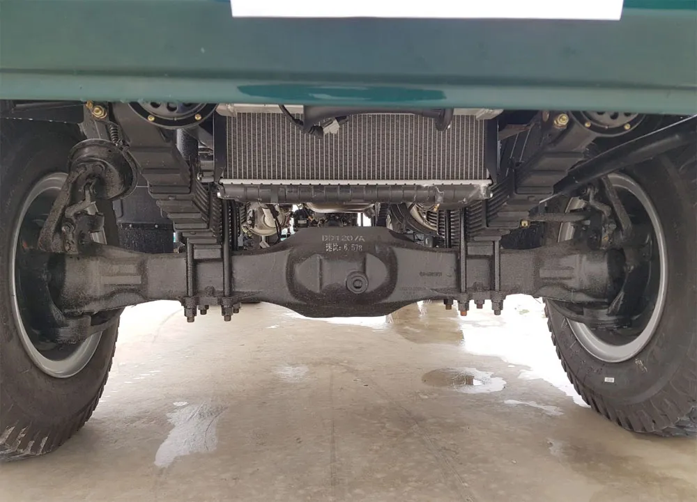 Hình ảnh minh họa hệ thống cầu trước và treo nhíp lá của xe ben 2 cầu